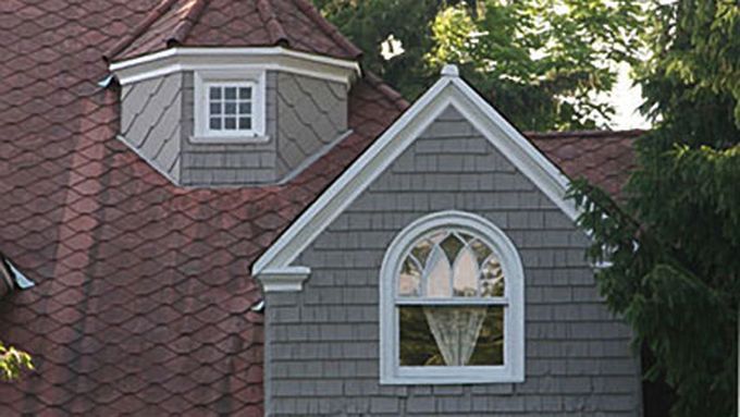 Victorian-style windows on a Victorian-era home.