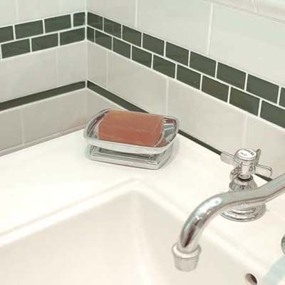 Vintage Brass Towel Holder and Oval Bathtub in Bay Window