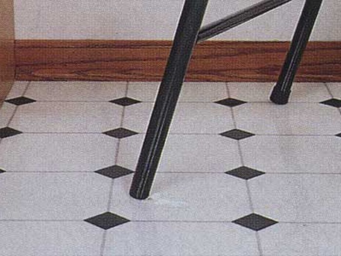 Damaged vinyl floor that needs to be fixed