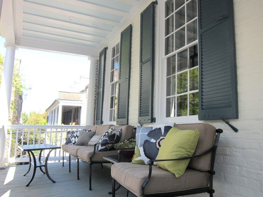 a patio with large windows that contain window inserts