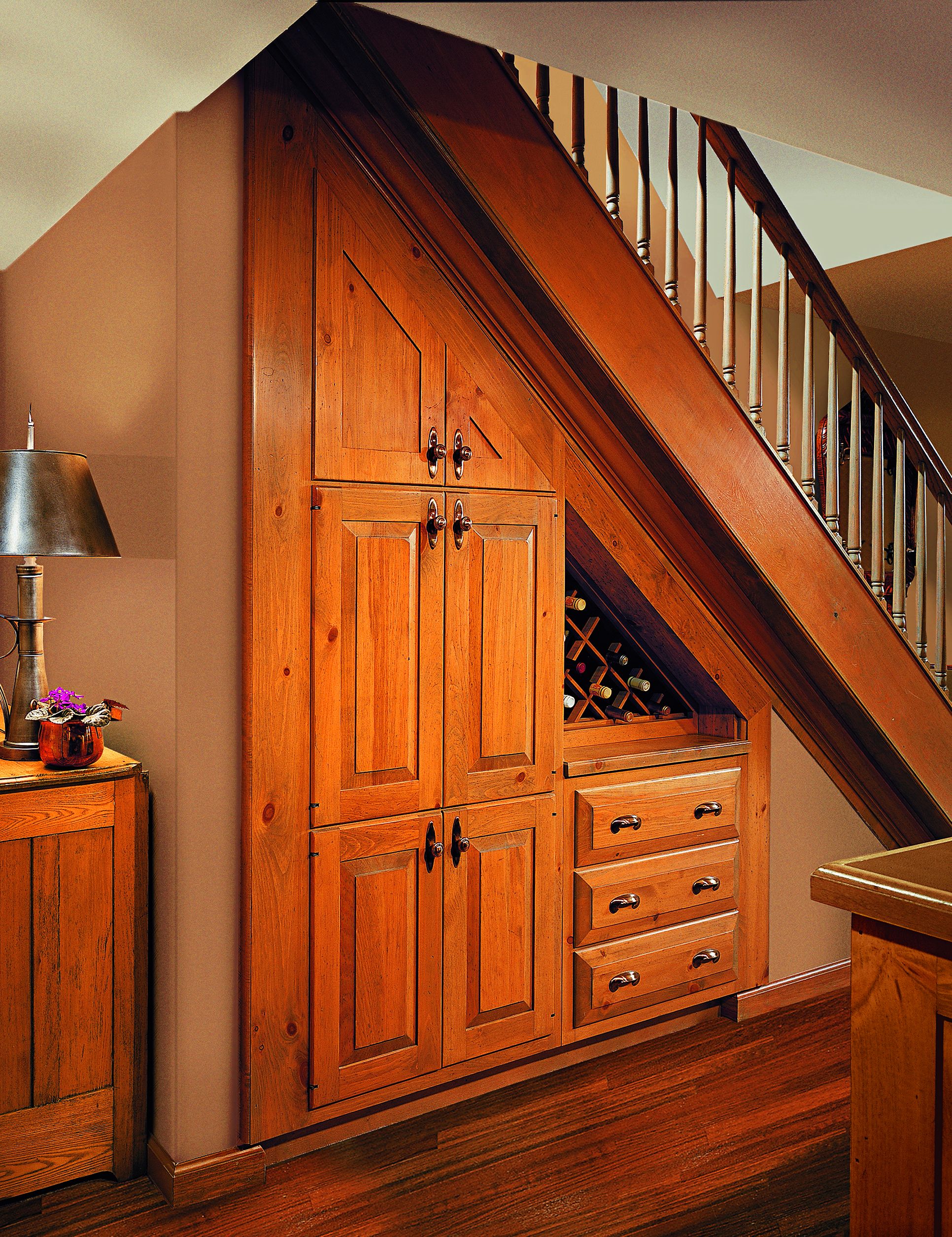 A wine cellar built below a stairwell.