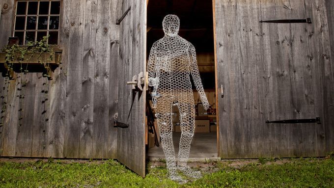 The silhouette of a man made out of chicken wire.