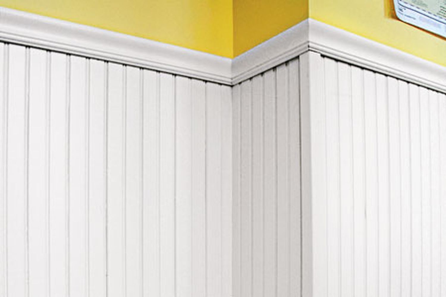 White painted wood beadboards being used as wainscoting.