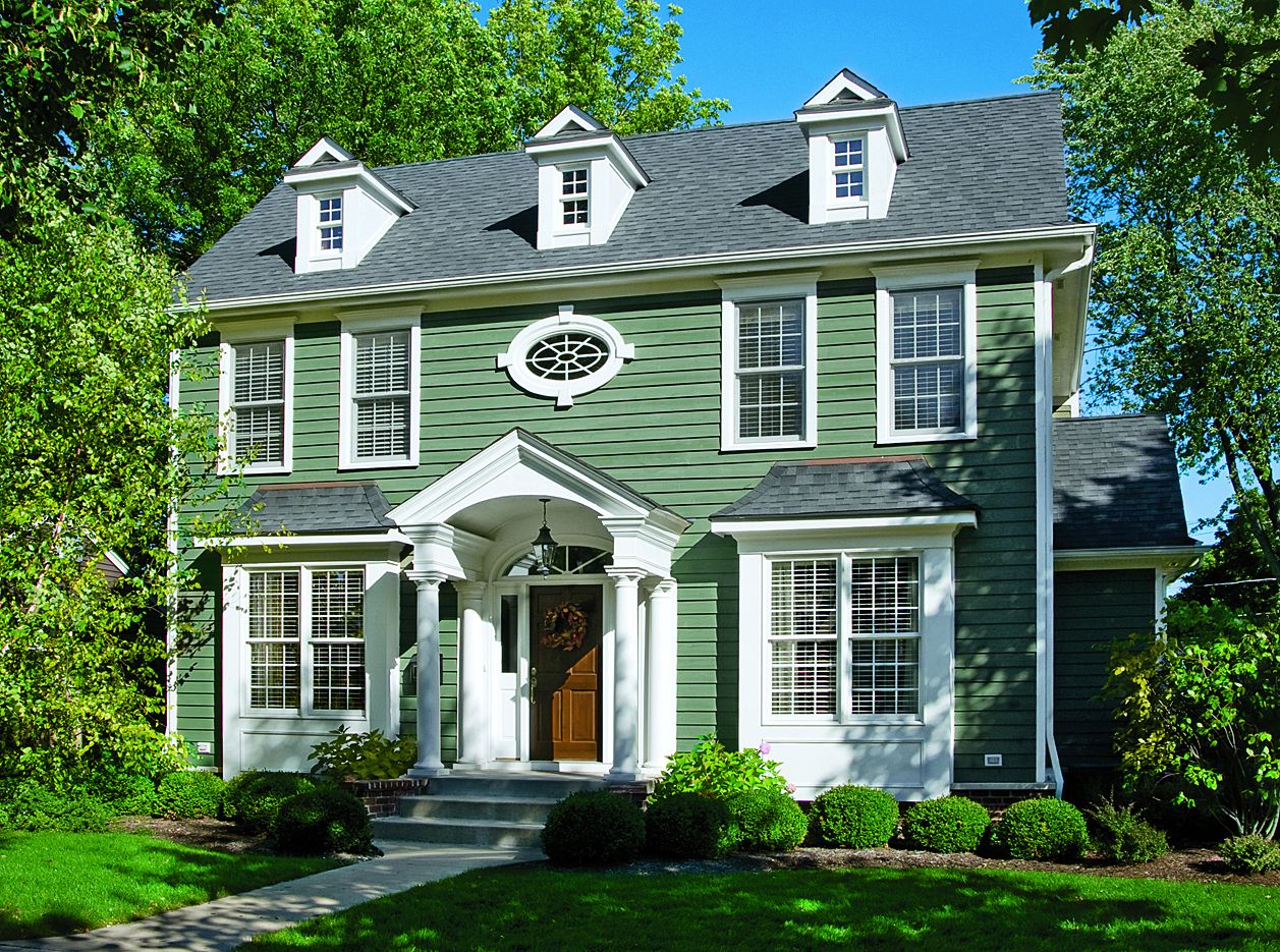 a gray and green stain on a house