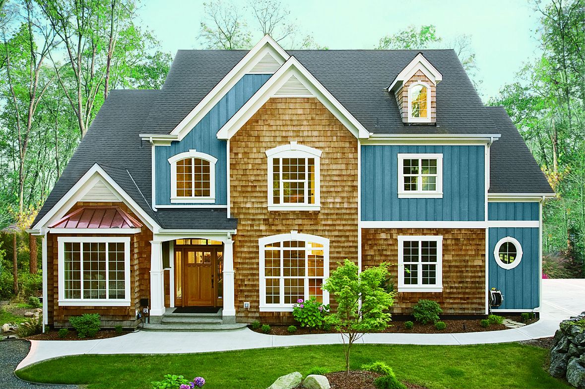 a house with wood shake and blue stain