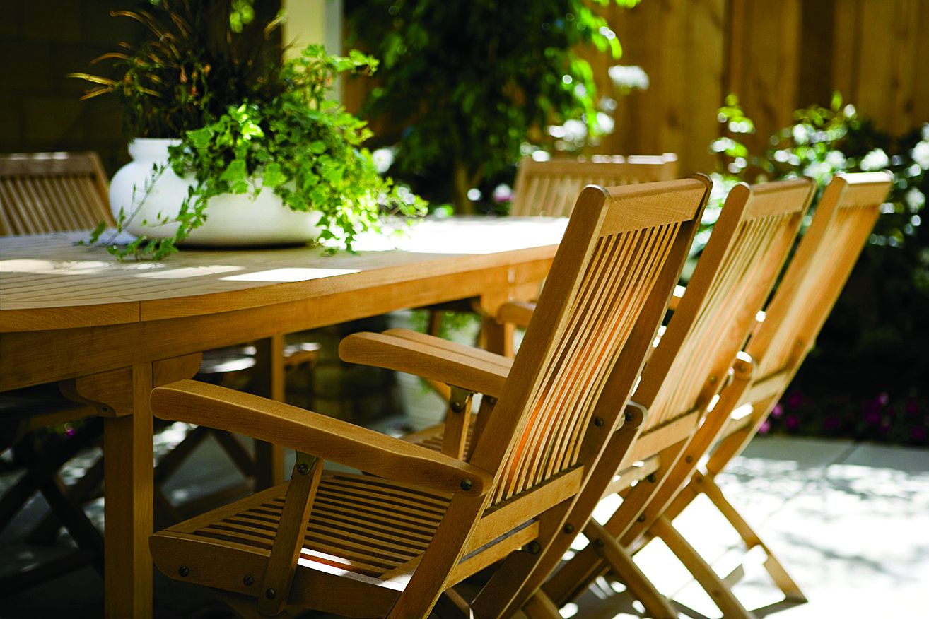 an outside kitchen table that has been stained