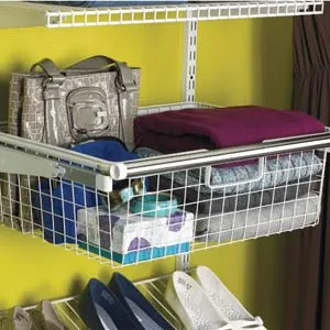 wire baskets within an organized closet that can hold items that don't sit well on a shelf