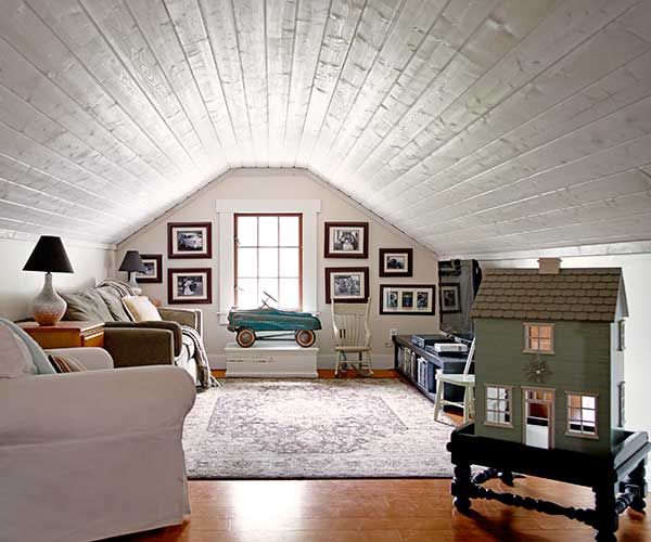 a converted attic that can be used for storage and furniture