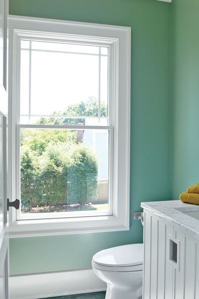 a big window in a small bathroom