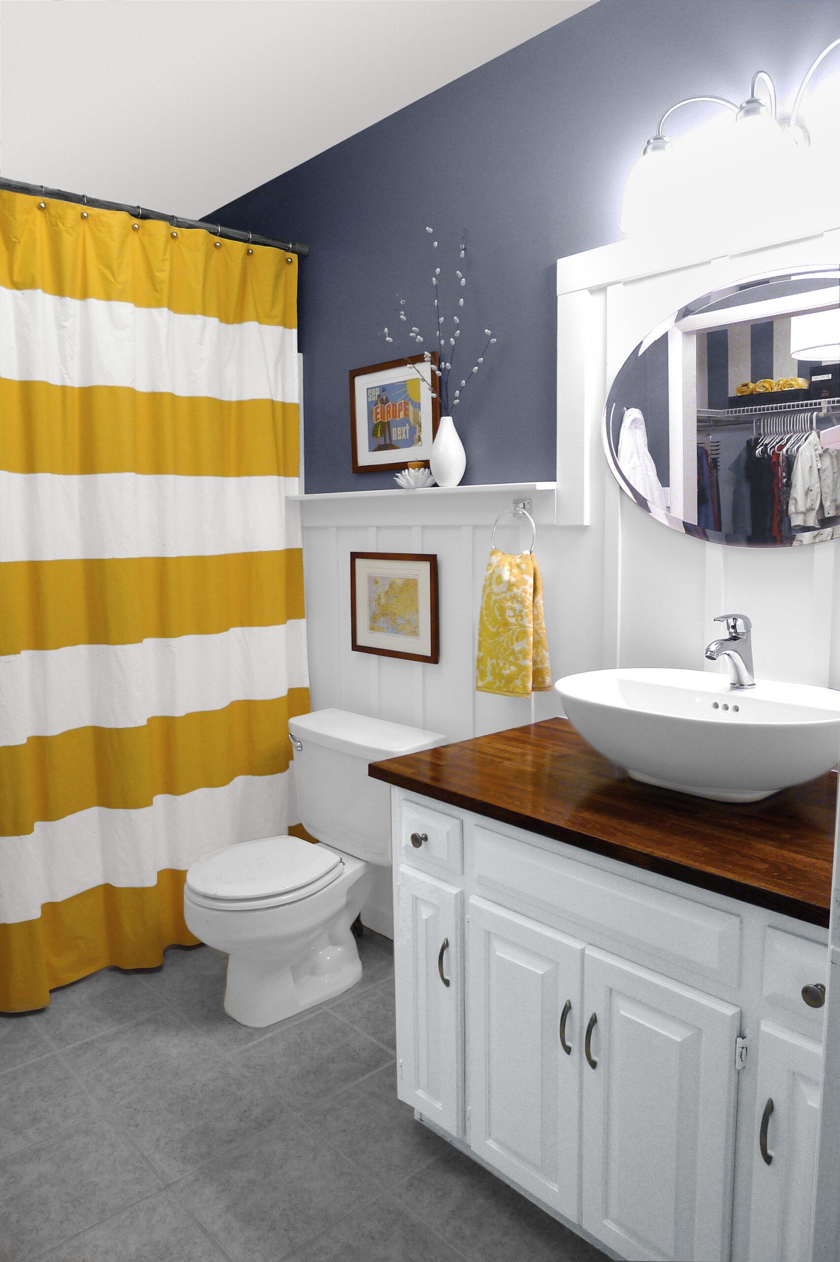 a chair rail added to a bathroom wall, acting as a shelf