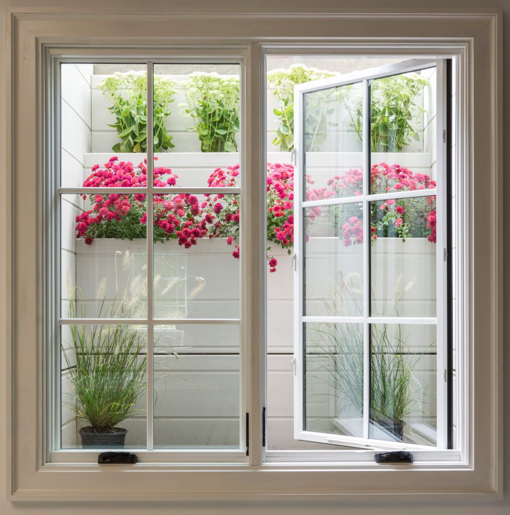 Open window with flowers in backgorund