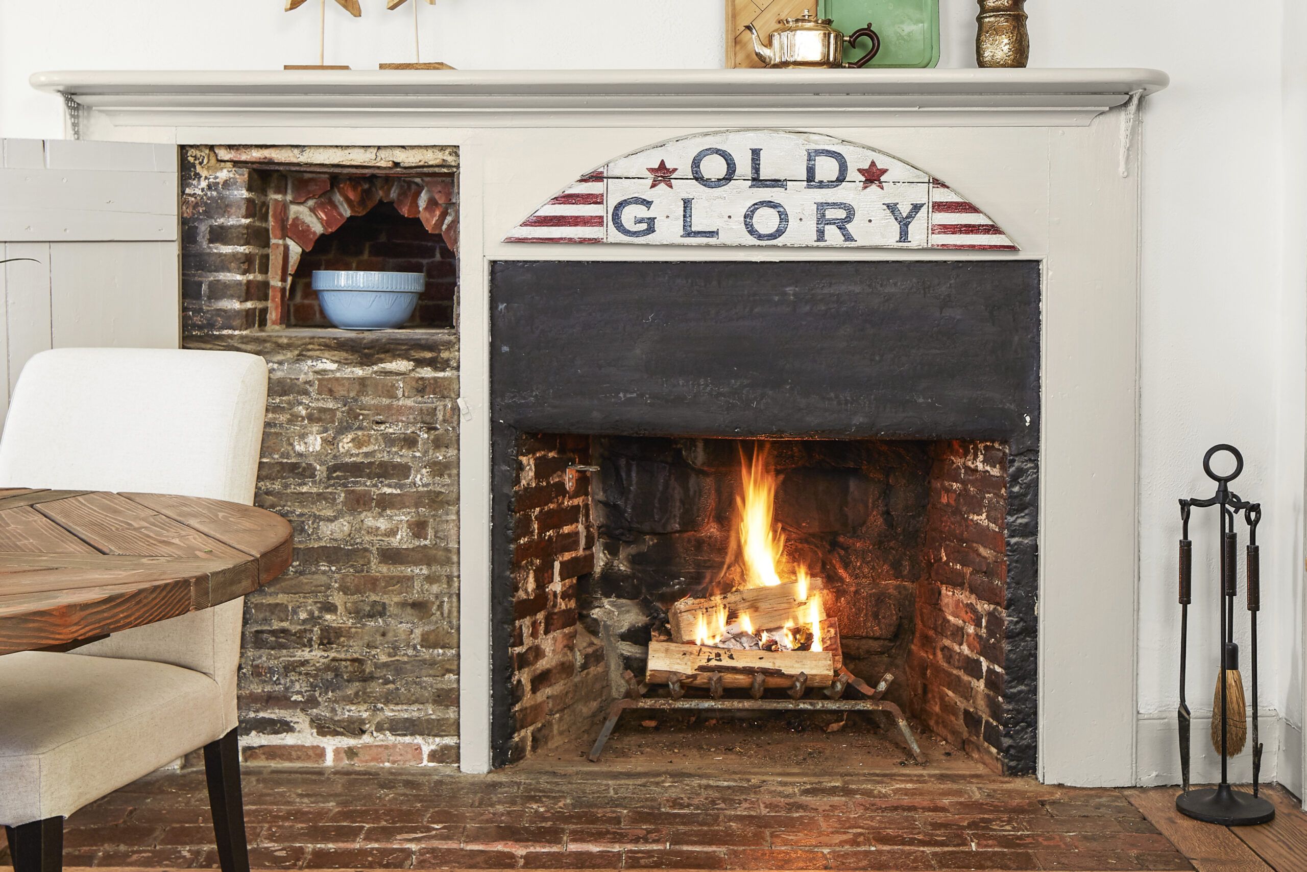 Burning fireplace with the words "Old Glory" written above it.