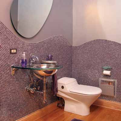 a unique tile shape along a wall in a bathroom