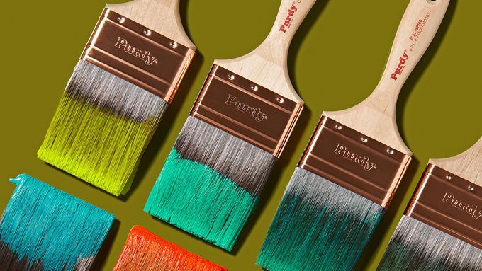 Paint brushes dipped in paint.