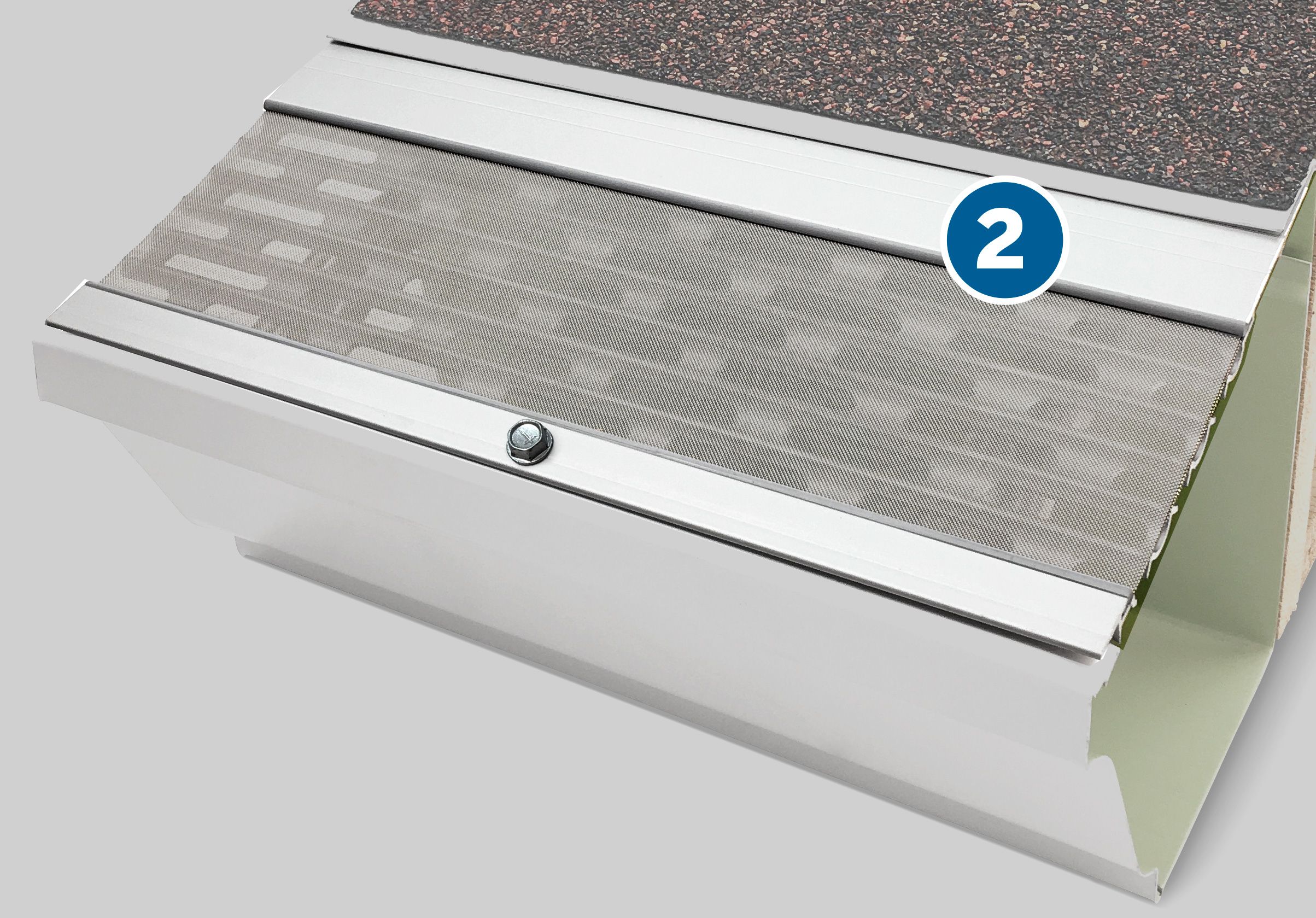 A Micromesh gutter guard hanging over the top of a gutter.