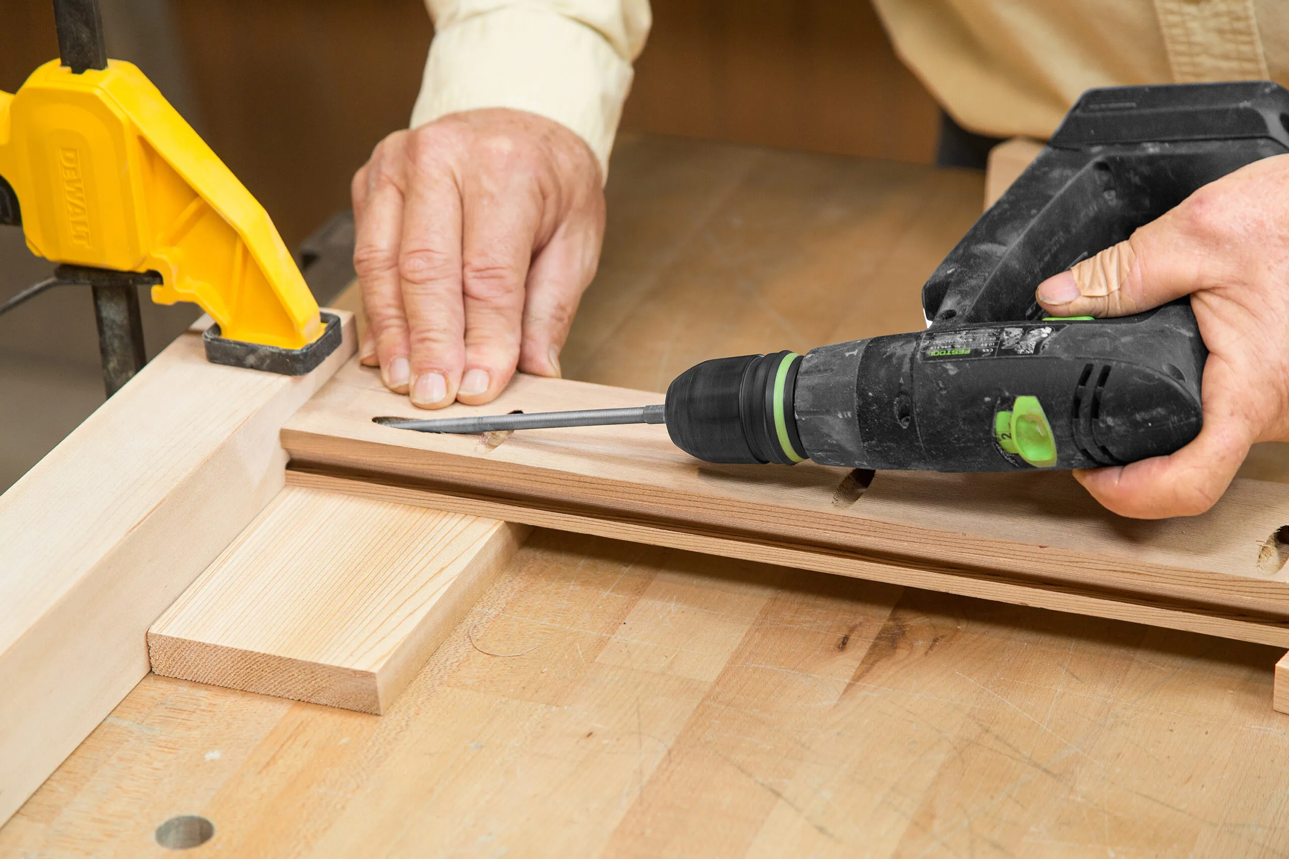 The top rails of the cedar planter box are attached by drilling through the pocket holes.