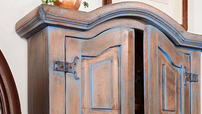 The top of a color washed patina on a cabinet.