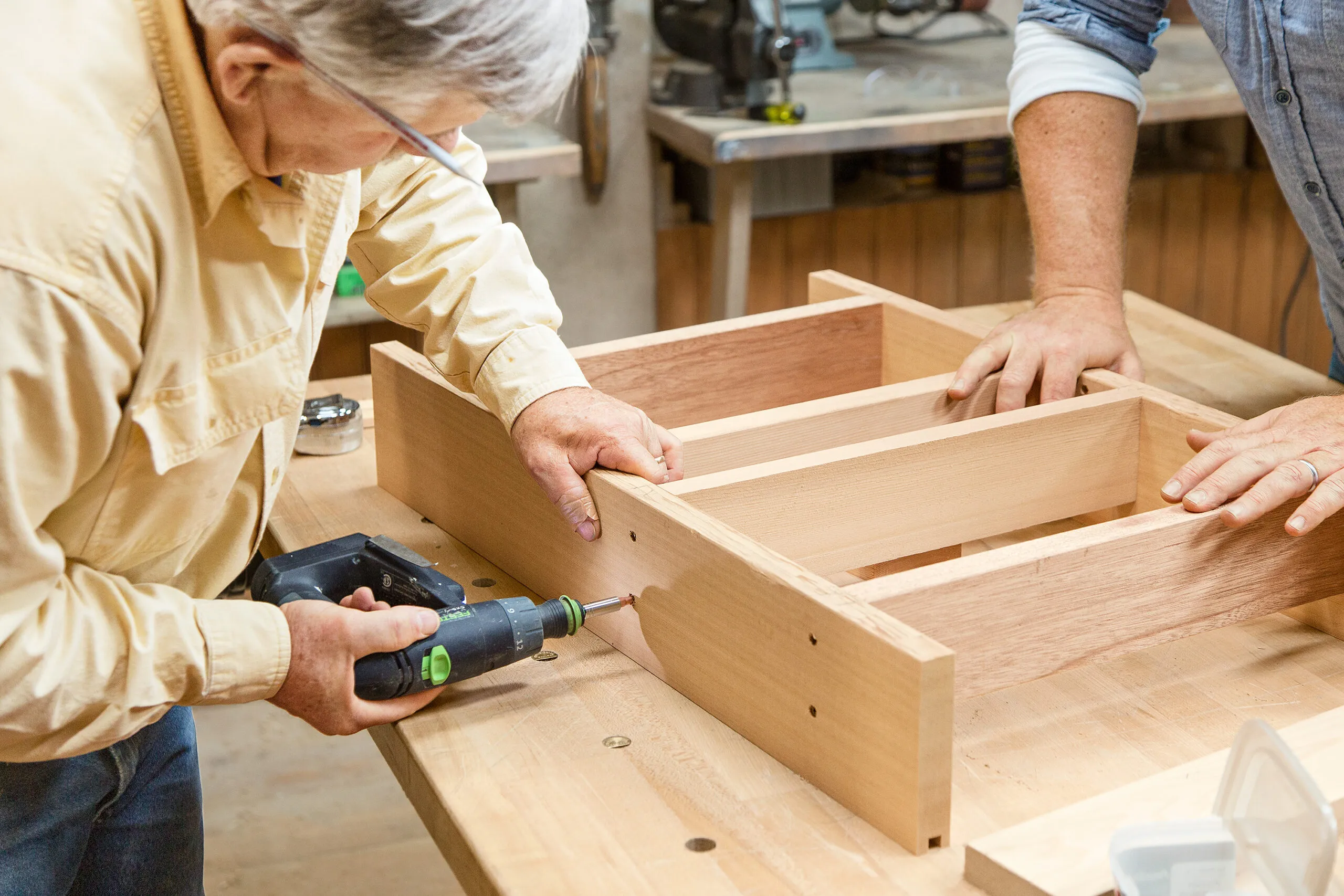 The base of the cedar planter box is drilled together.