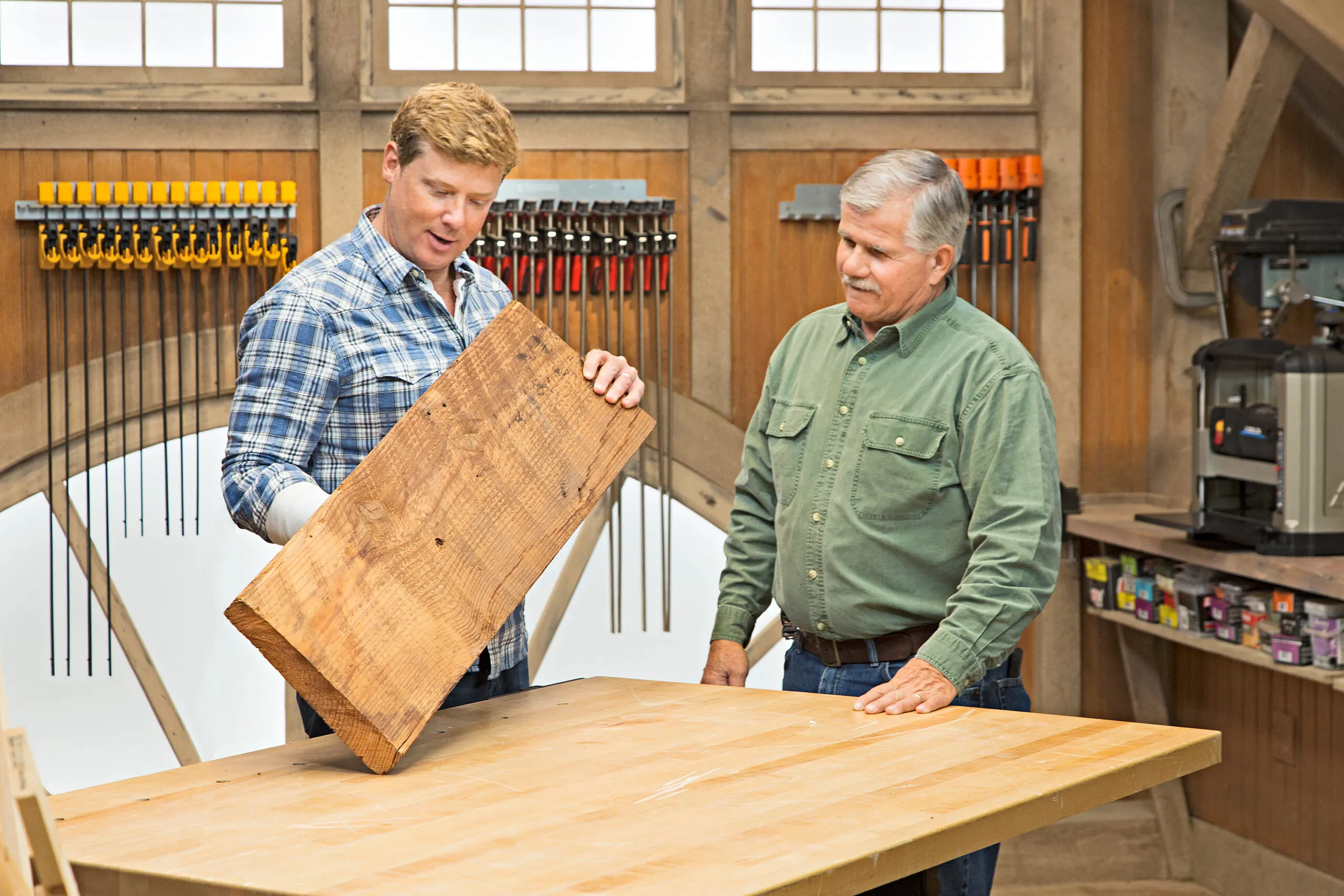 Two man admire an end grain cutting board.
