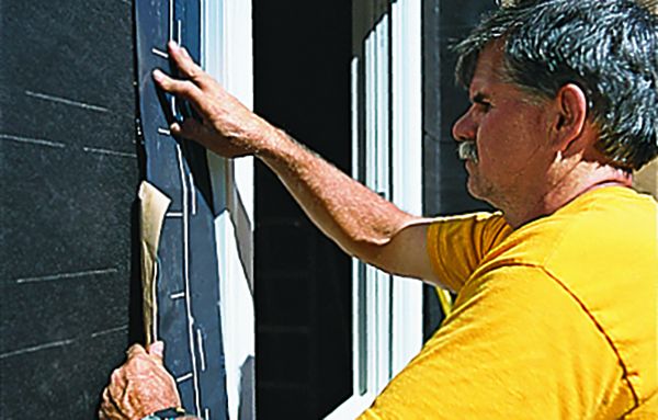 installing trim casing and caulking a new window