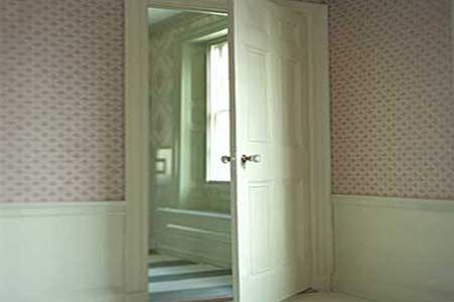 An old door installed into a new frame.
