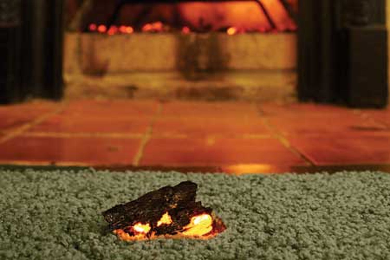 Carpet with a burn mark that can be fixed with a carpet patch.