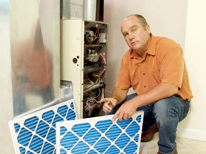 Richard Threthewey changing a filter.