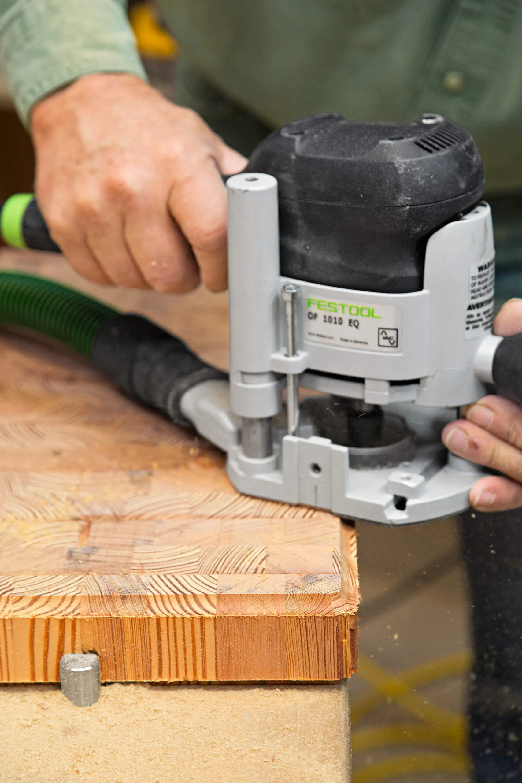 A cutting board is pictured being finished.