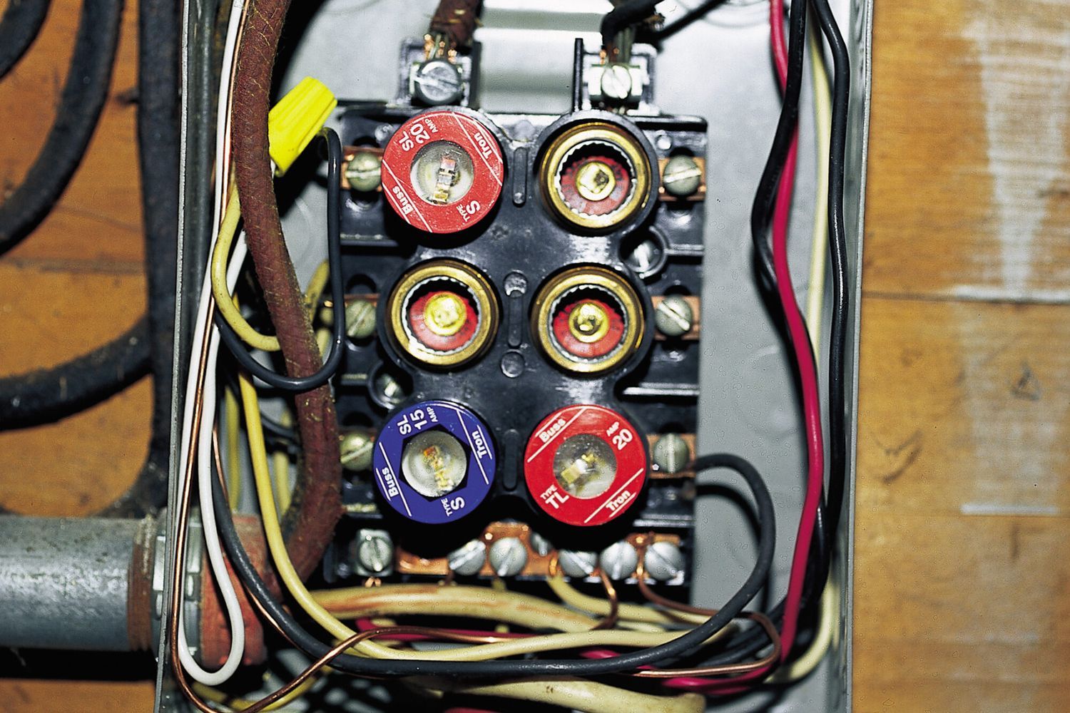 A box with several electrical wires and dials.