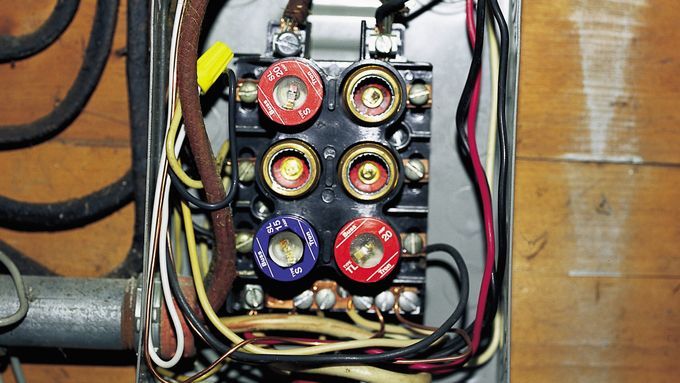 A box with several electrical wires and dials.