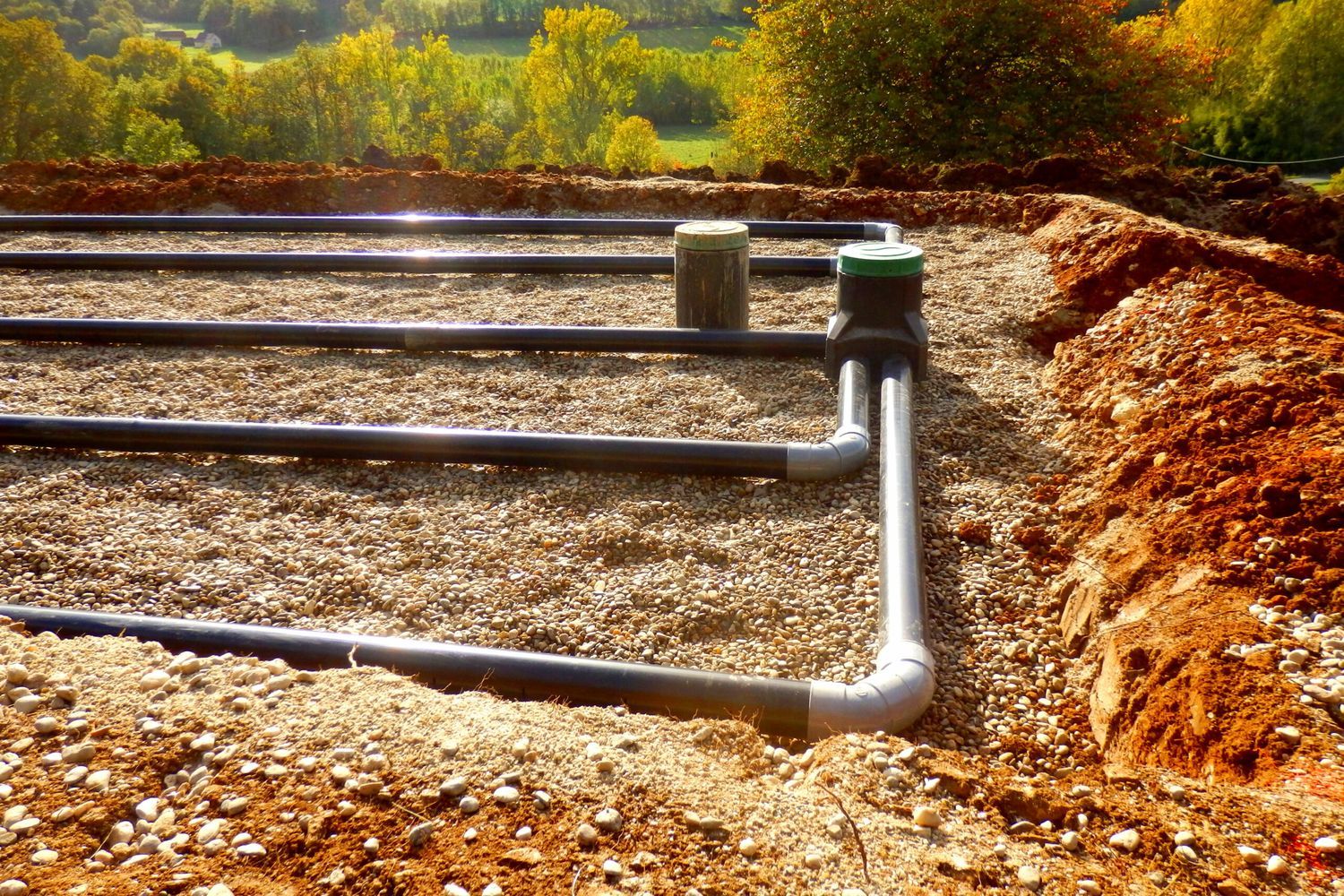 Image of a sand and gravel filter bed for a septic system. Septic systems are complex and require regular maintenance.