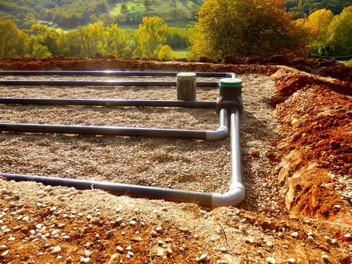 Image of a sand and gravel filter bed for a septic system. Septic systems are complex and require regular maintenance.