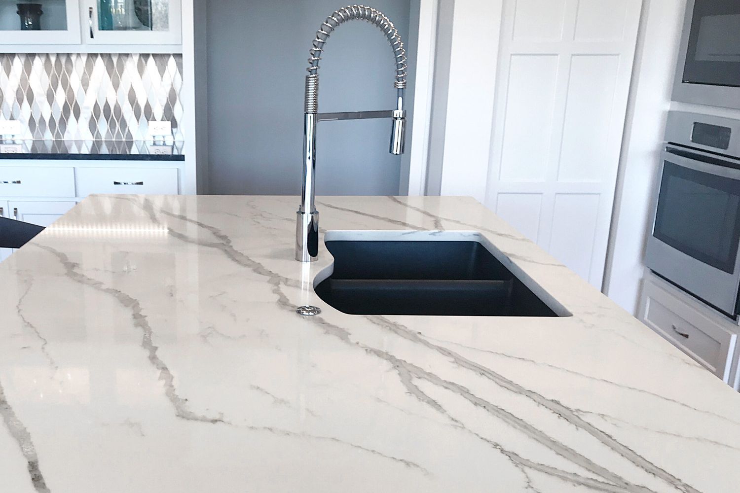 A painted faux marble countertop in a kitchen.