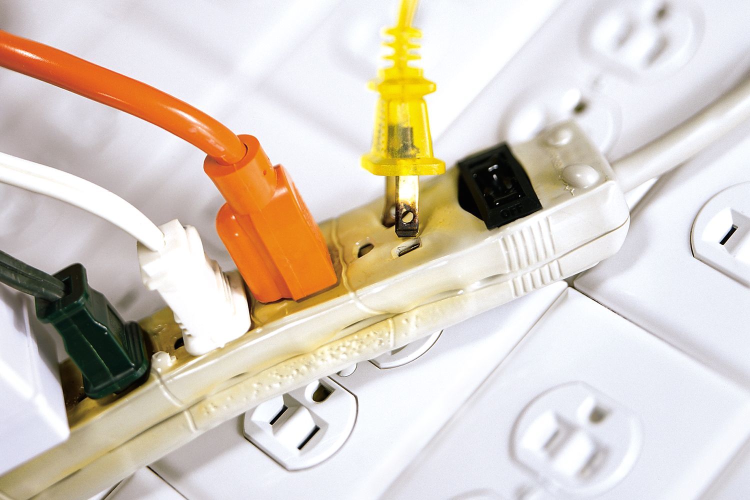 A surge protector with cord plugged in.