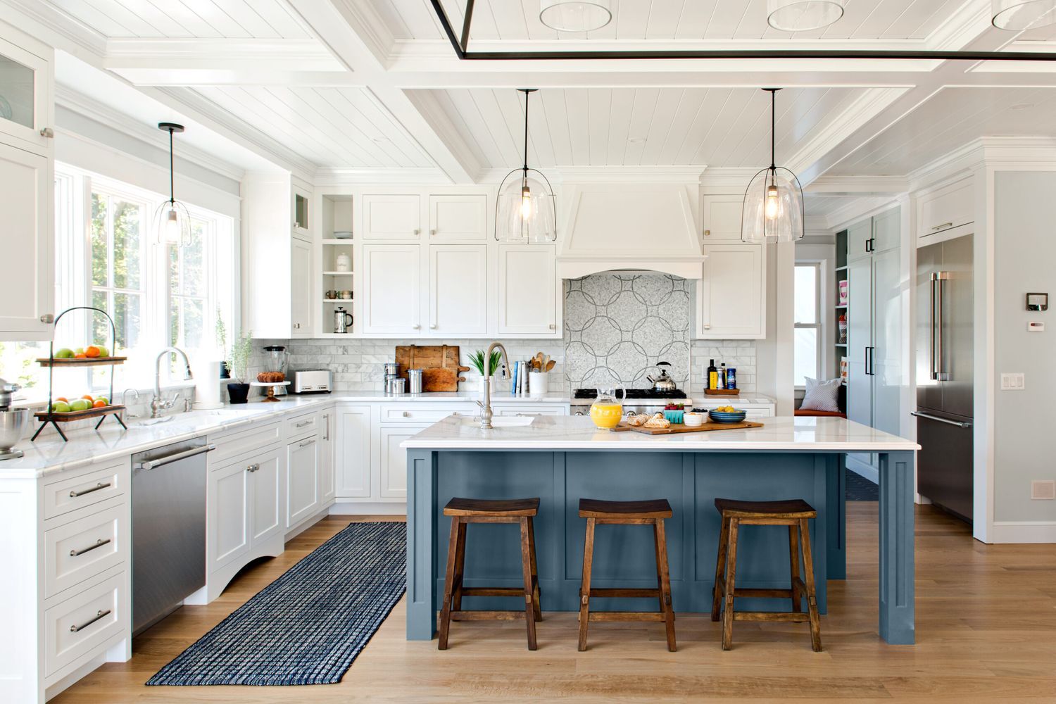 A kitchen island in large modern kitchen.