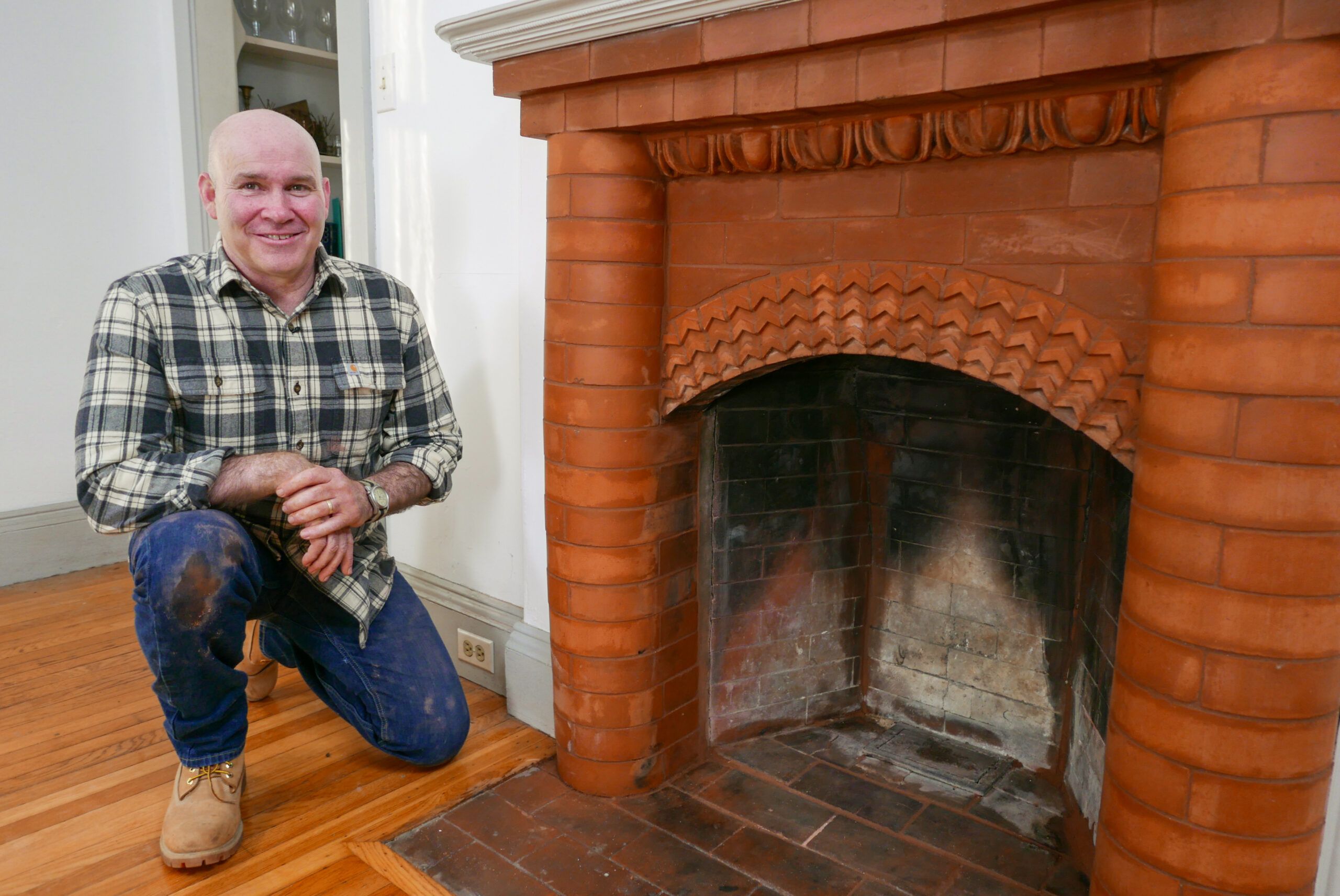 building stone tile fireplace with single shelf