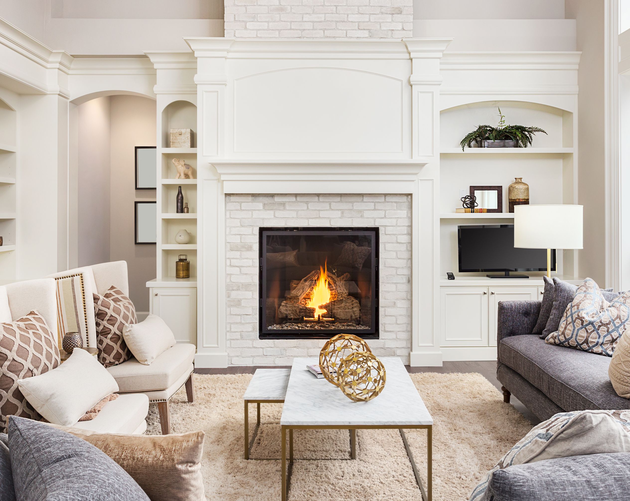 Image of a fireplace with firebrick installed around it