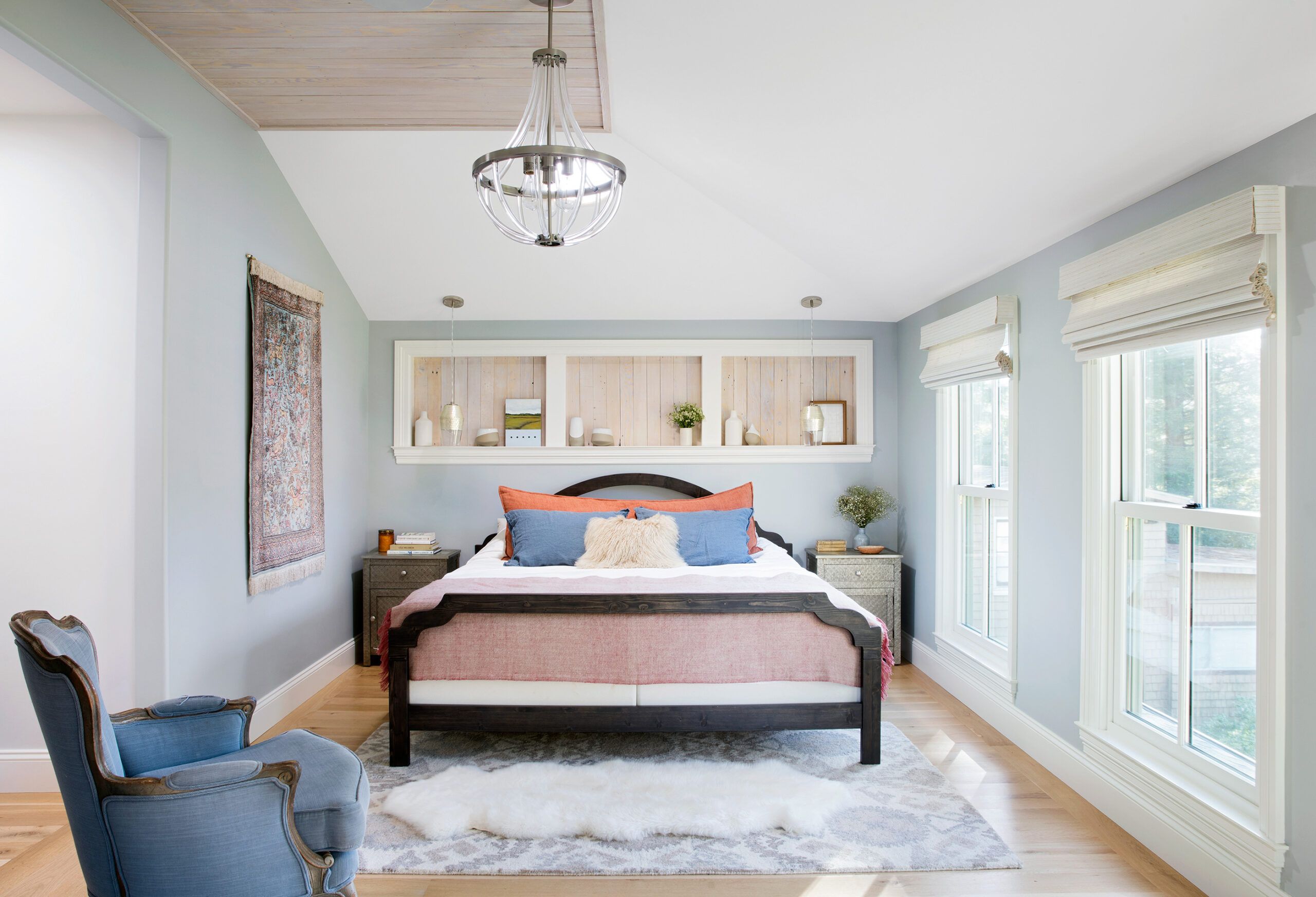 a bedroom complete with a bed containing many clean pillows