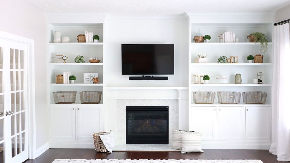 Jenn Largesse builds a custom built-in shelving unit for a fireplace surround