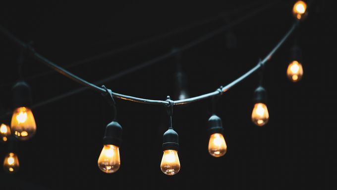 A string light setup shining in the dark.