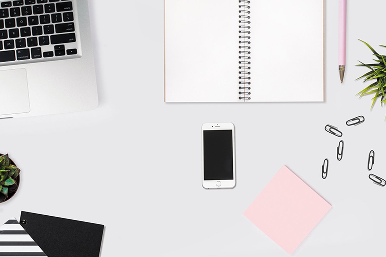 Home office supplies on top of a desk.