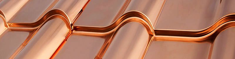 Up close look at the seam of a copper roof, which is a type of metal roofing.