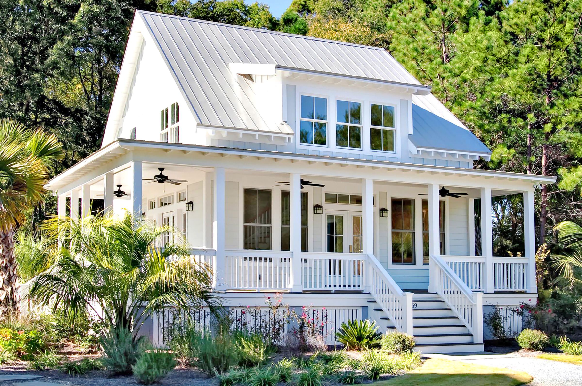 White house with light gray metal roofing.