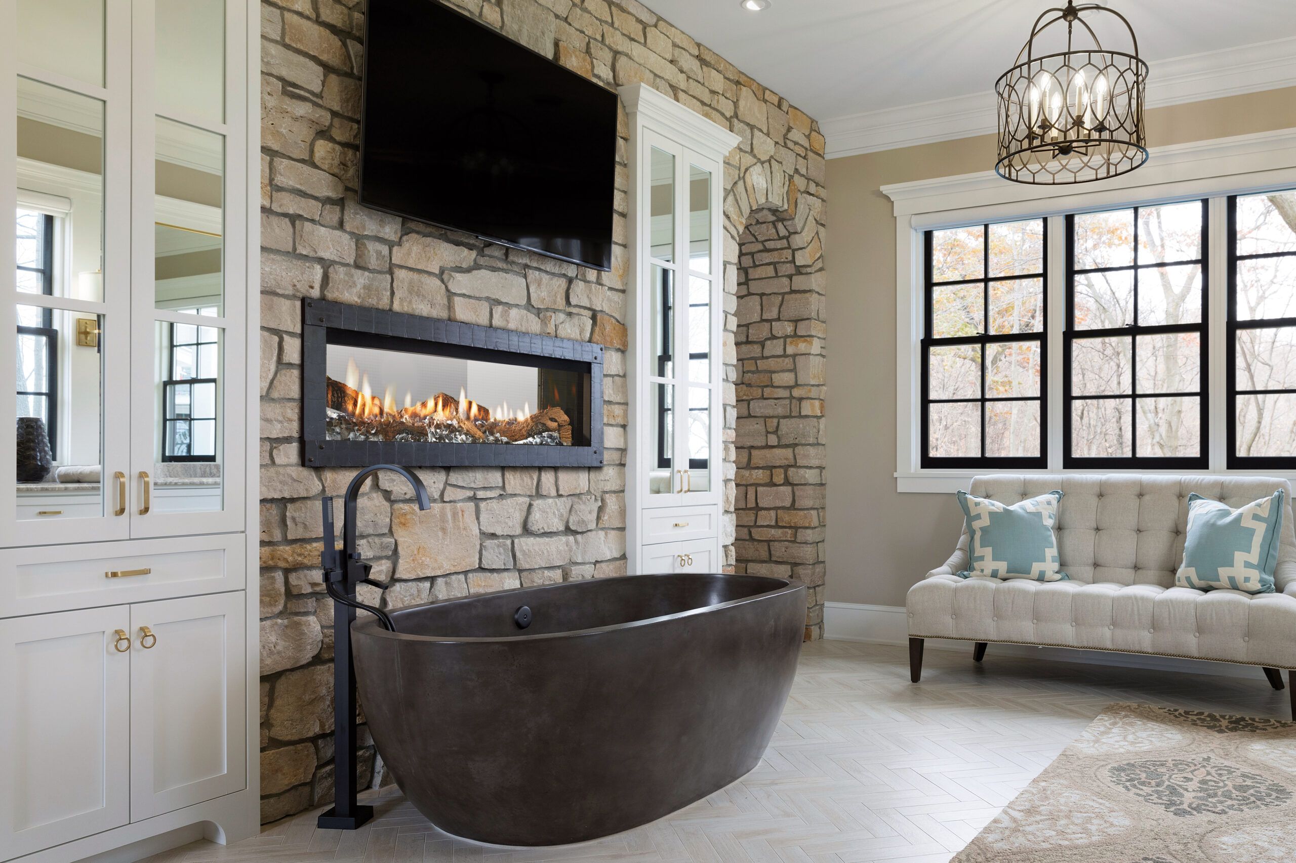 A gas fireplace in a bathroom.