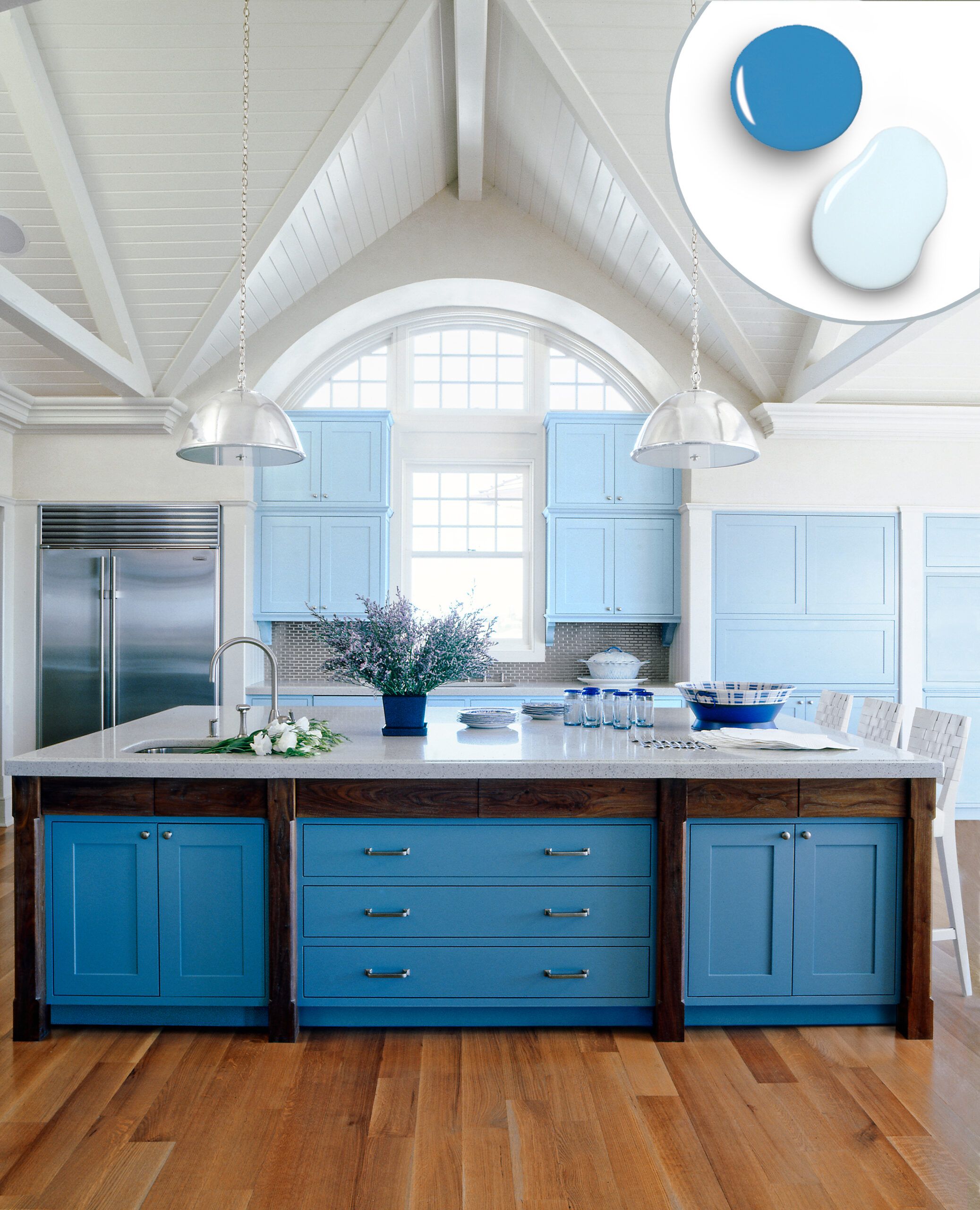 Kitchen cabinets with a sea blue and sky blue color combination.