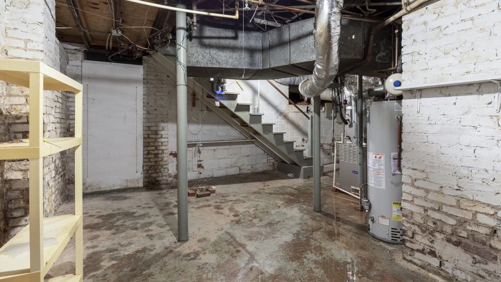 Stairs descending into a wet basement that needs to be dried out.