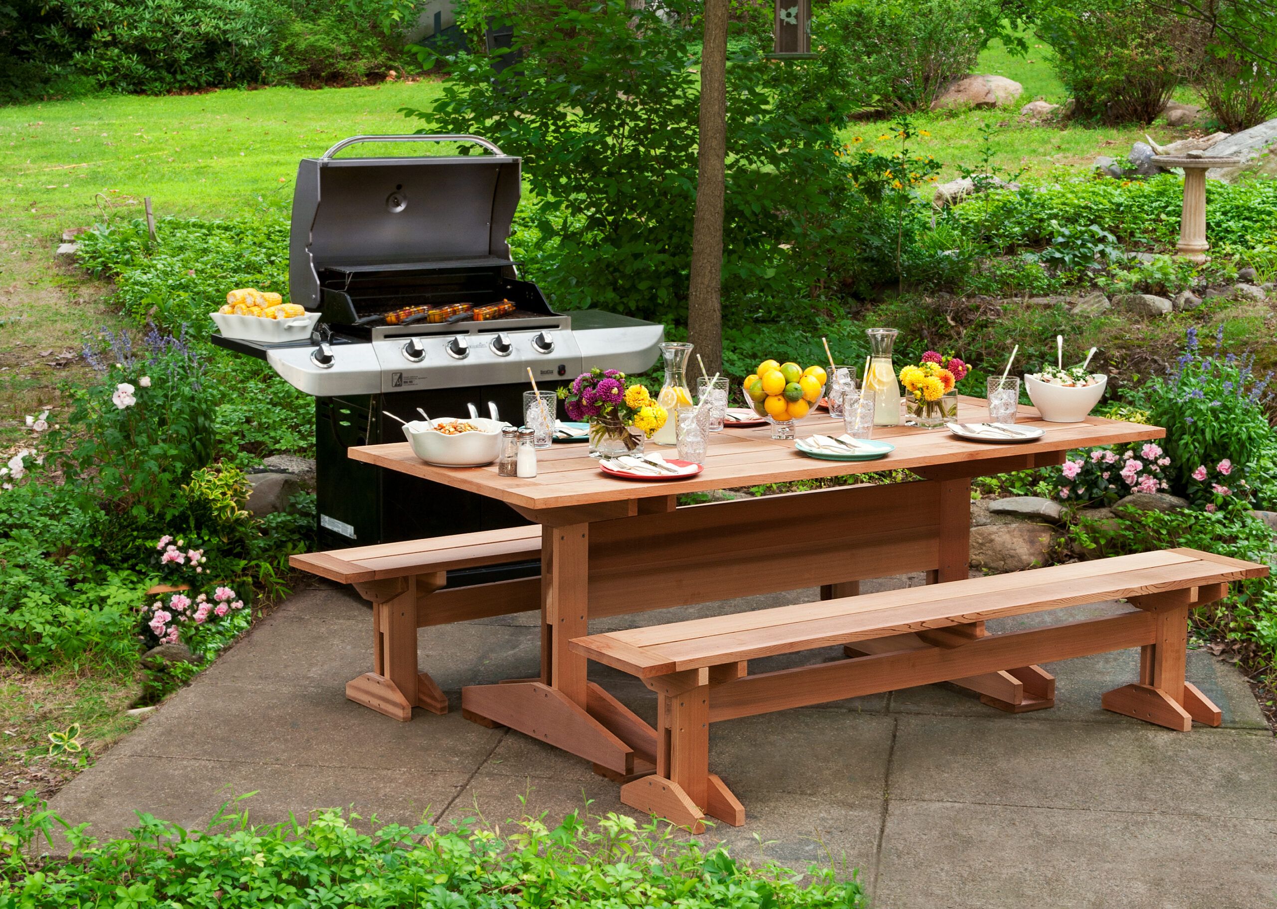a grill and patio picnic table