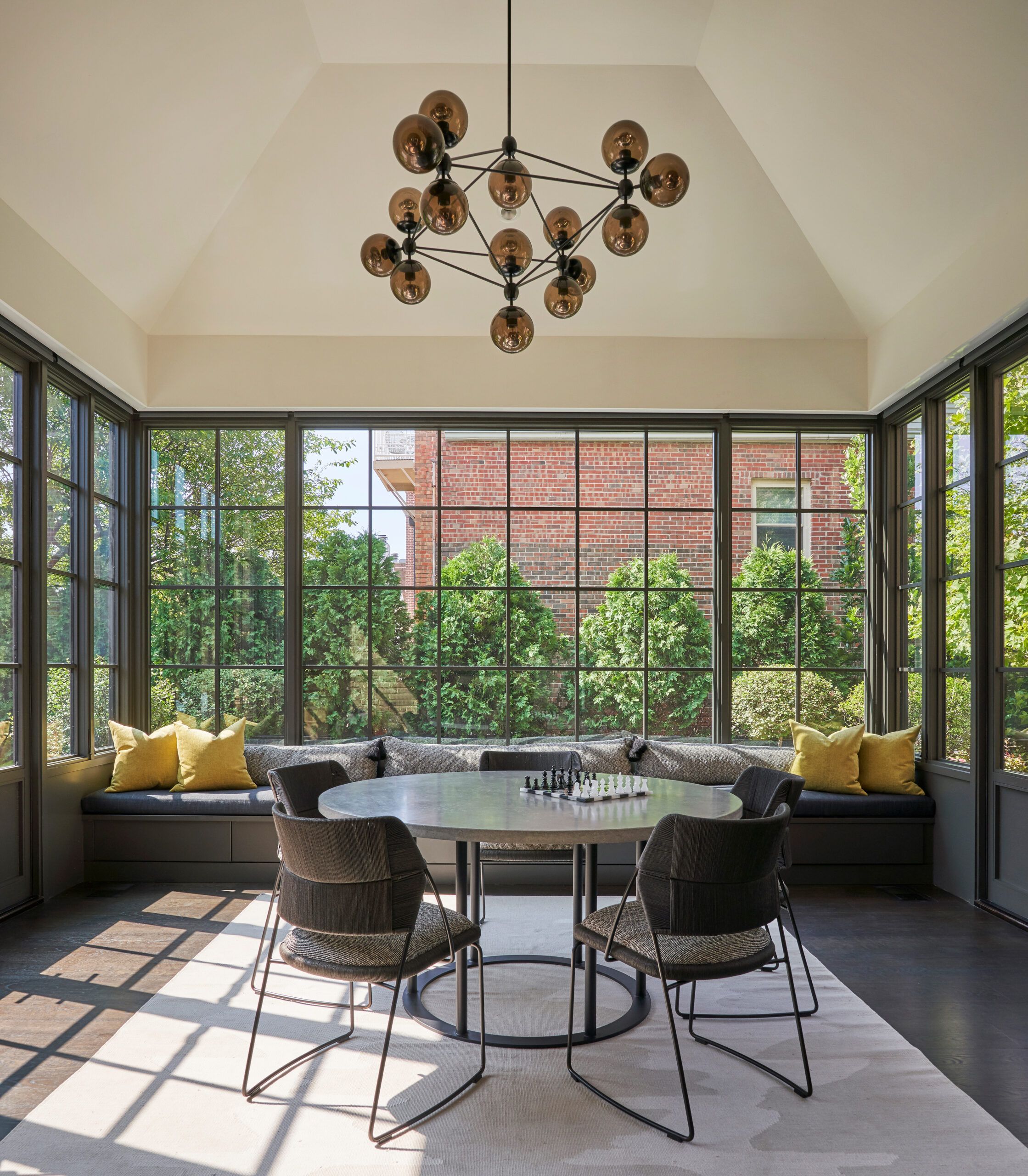 Image of a game sunroom, with a table in the middle with a chessboard on top