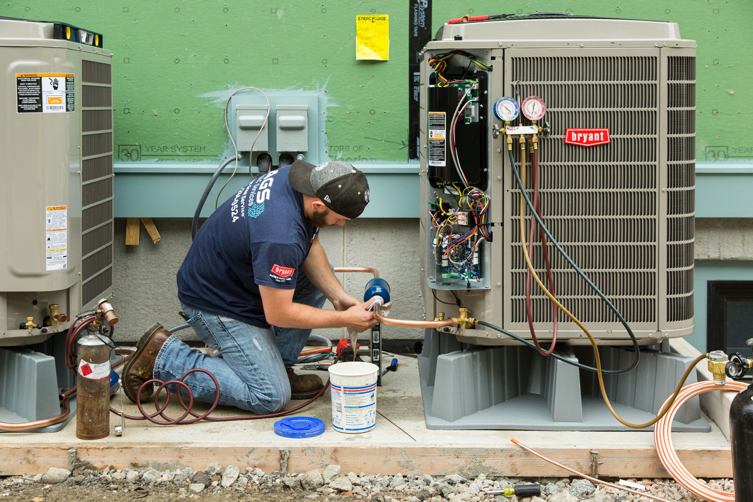 A professional repairing an air conditioner.