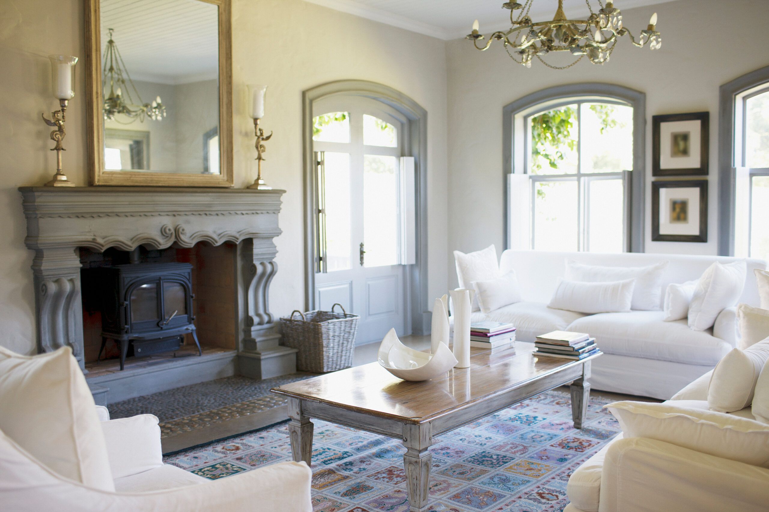 A sitting room with a large mirror.